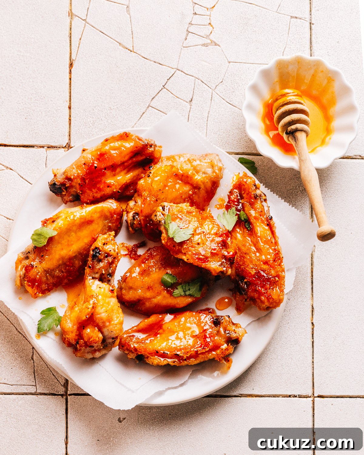 Hot honey wings on a plate.