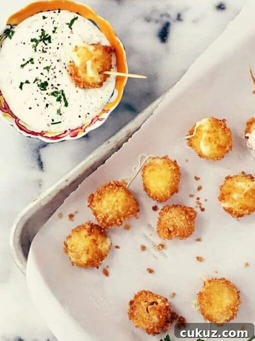 Mini mozzarella sticks with jalapeno ranch dip.