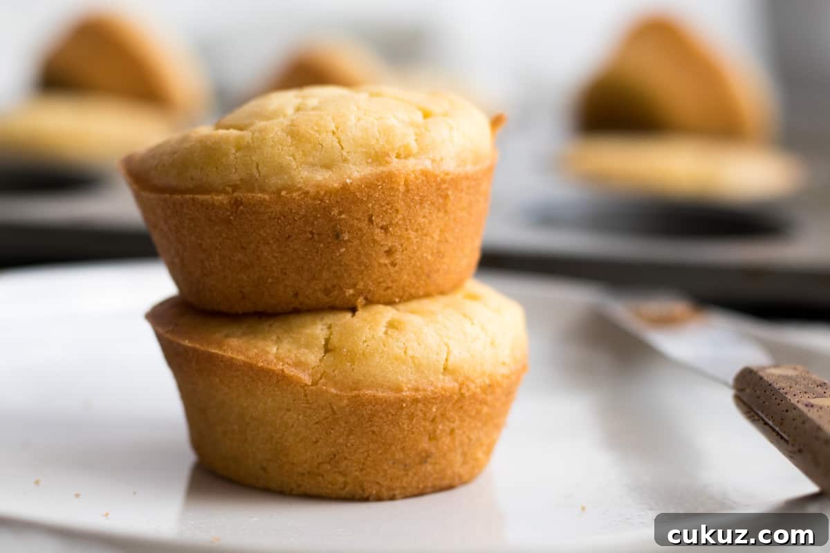 two mochi muffins stacked on a white plate