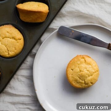 mochi muffin on a plate next to a muffin tin