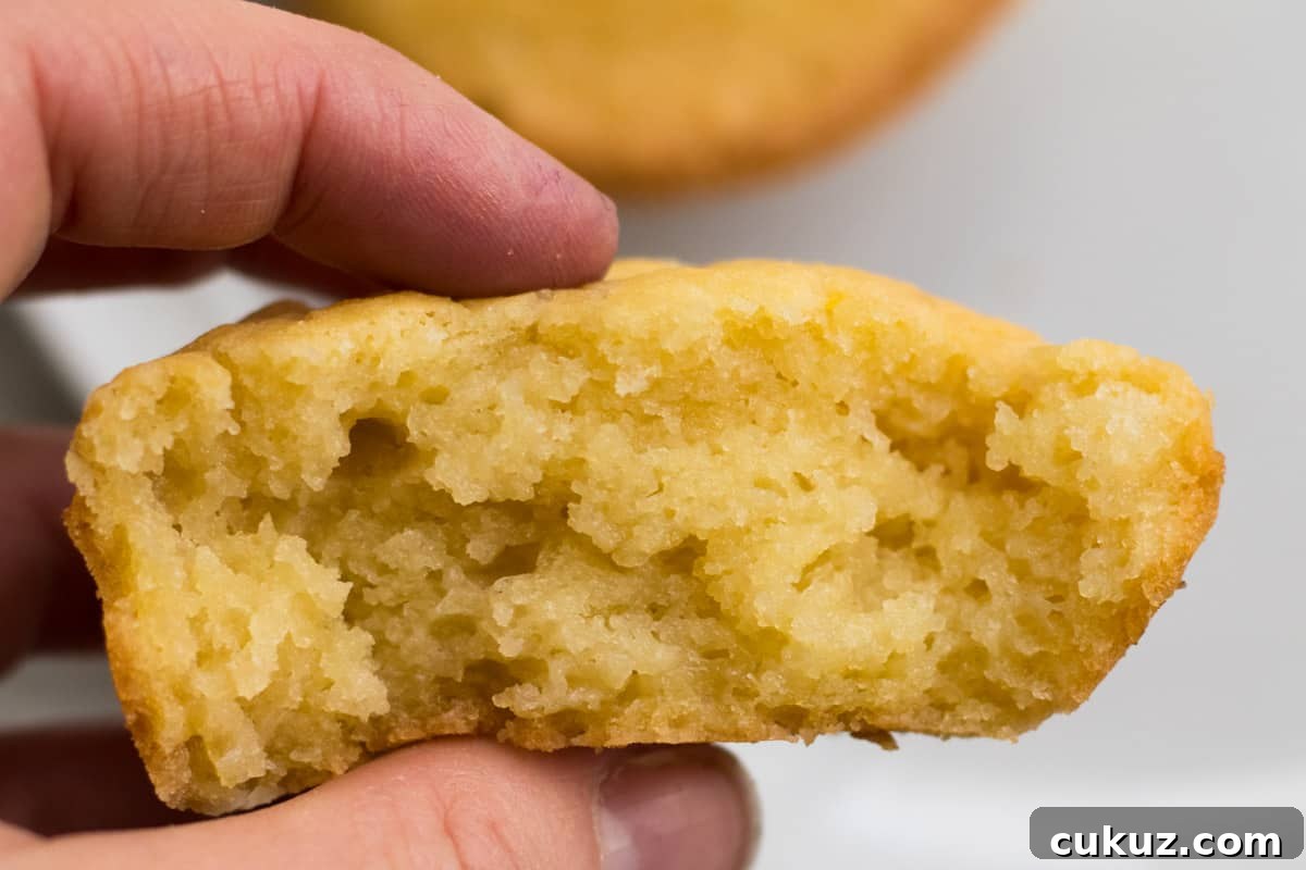 fingers showing texture of mochi muffin