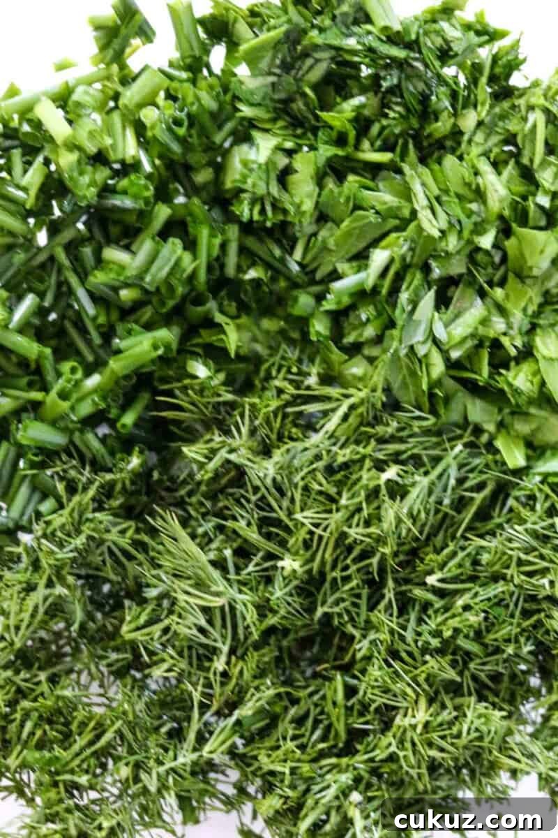 Chopped fresh herbs in a bowl.