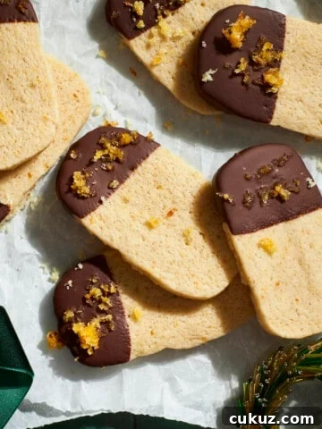 Sourdough Discard Shortbread Cookies on white parchment paper.