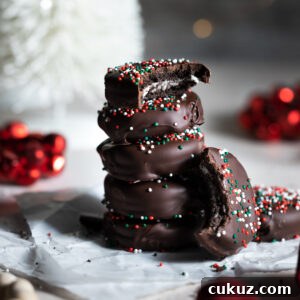 Stack of chocolate covered oreos.
