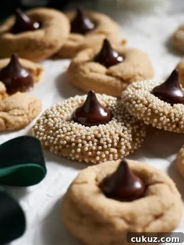 A pile of Sourdough Discard Peanut Butter Blossoms.