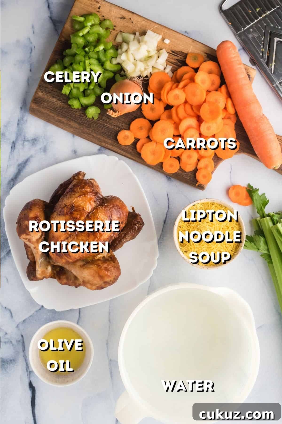 Rotisserie Chicken Noodle Soup Made with Lipton Broth 4 Vegetables on a cutting board and a rotisserie chicken with some Lipton noodle soup mix.