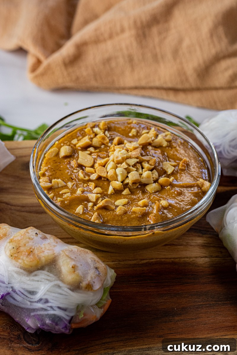 Creamy Peanut Dipping Sauce Recipe for Asian-Inspired Dishes 2 bowl of peanut butter dipping sauce topped with chopped peanuts