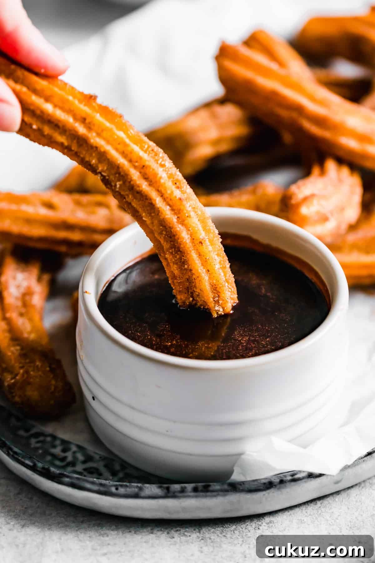 How to Make Crispy Homemade Churros with Chocolate Dipping Sauce 9 Dipping churros in chocolate sauce. Recipe by Easy Weeknight Recipes.