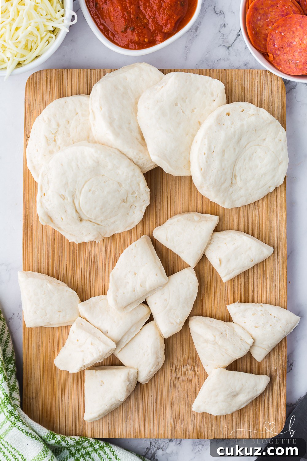Cut the biscuits into quarters