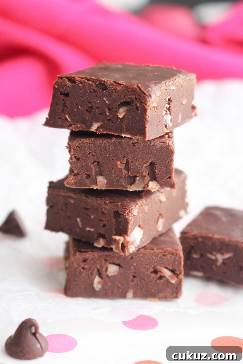 Side view of a stack of 4 pieces of this fudge recipe made without condensed milk, fully set and cut.