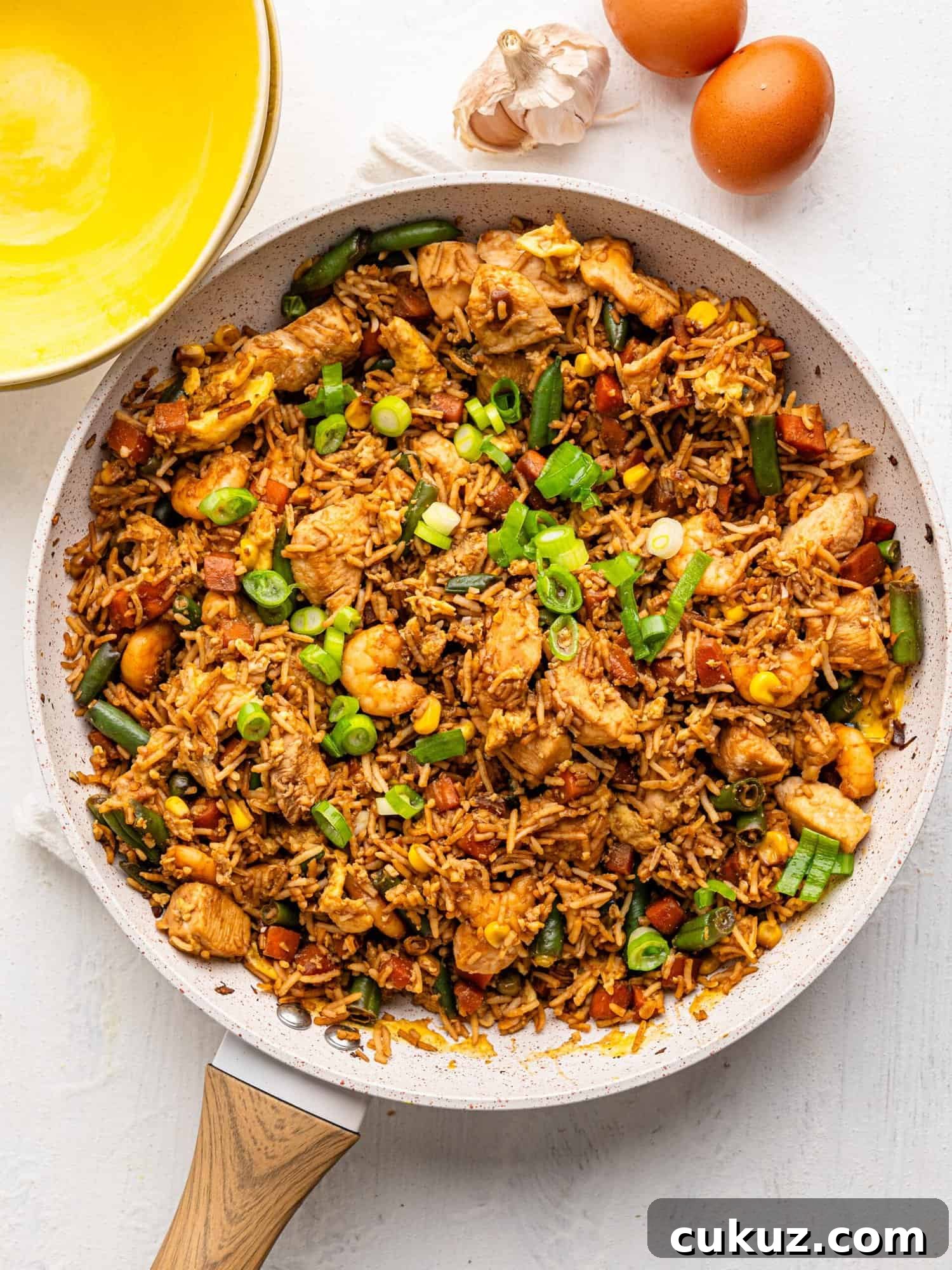 Shrimp and Chicken fried rice in a frying pan.