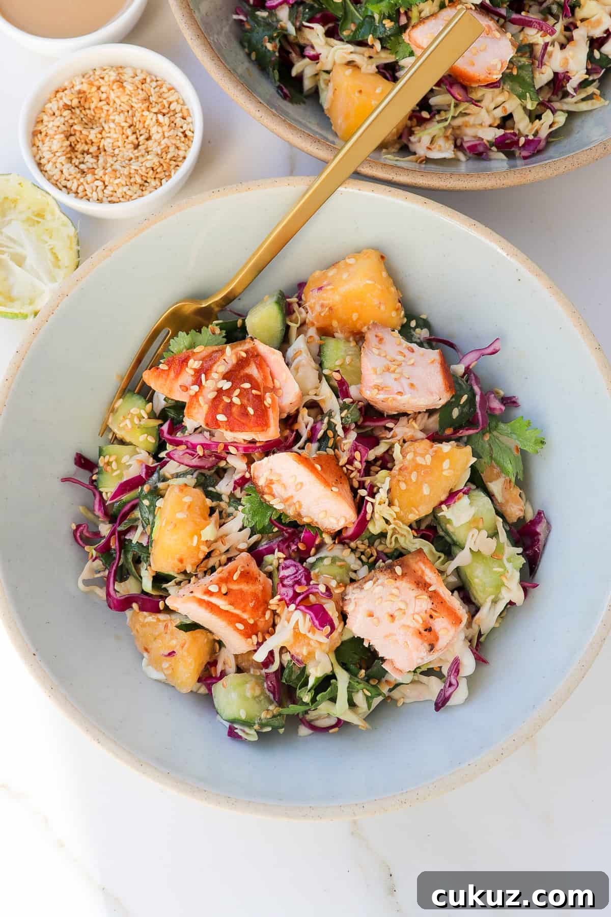 Close up view of summer salmon salad bowl.