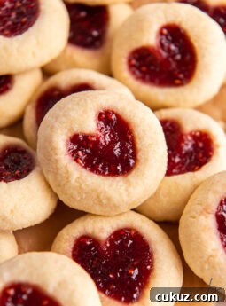 jam heart cookies in a pile on top of each other.