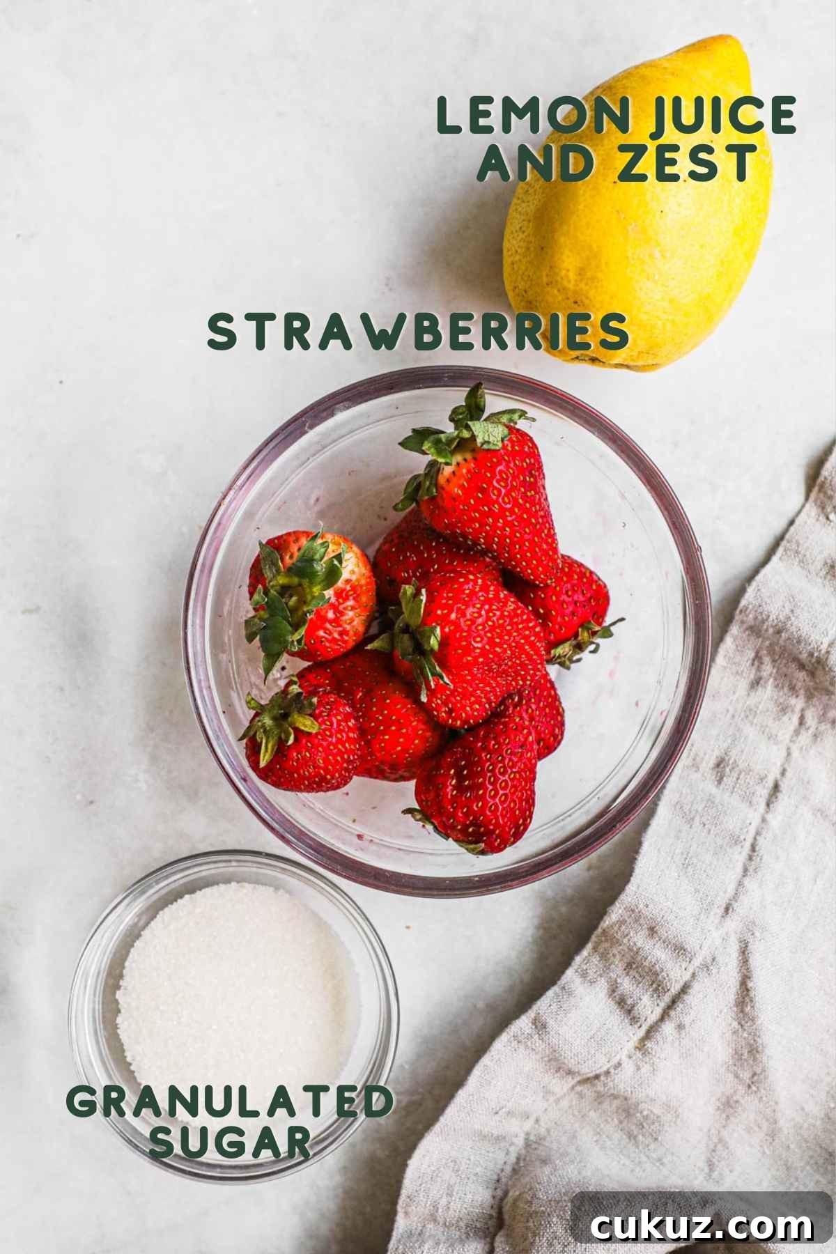 Ingredients to make strawberry compote, including strawberries, lemon juice and zest, and granulated sugar.
