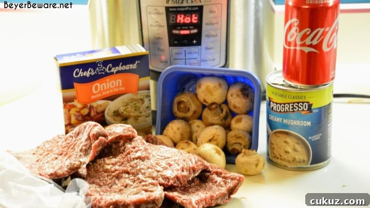 Cubed steaks with mushrooms and creamy cola sauce in the Instant Pot.