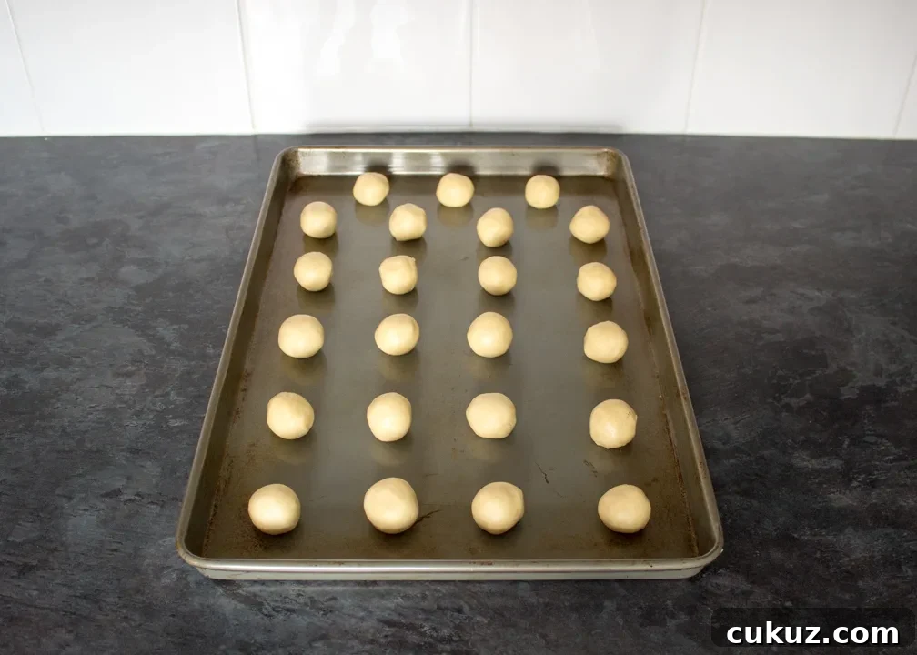 Cookie dough balls on a baking tray