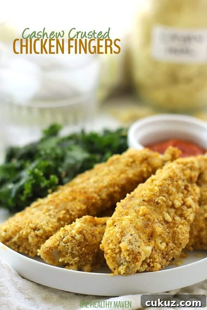 Baked Cashew Crusted Chicken Fingers on a plate