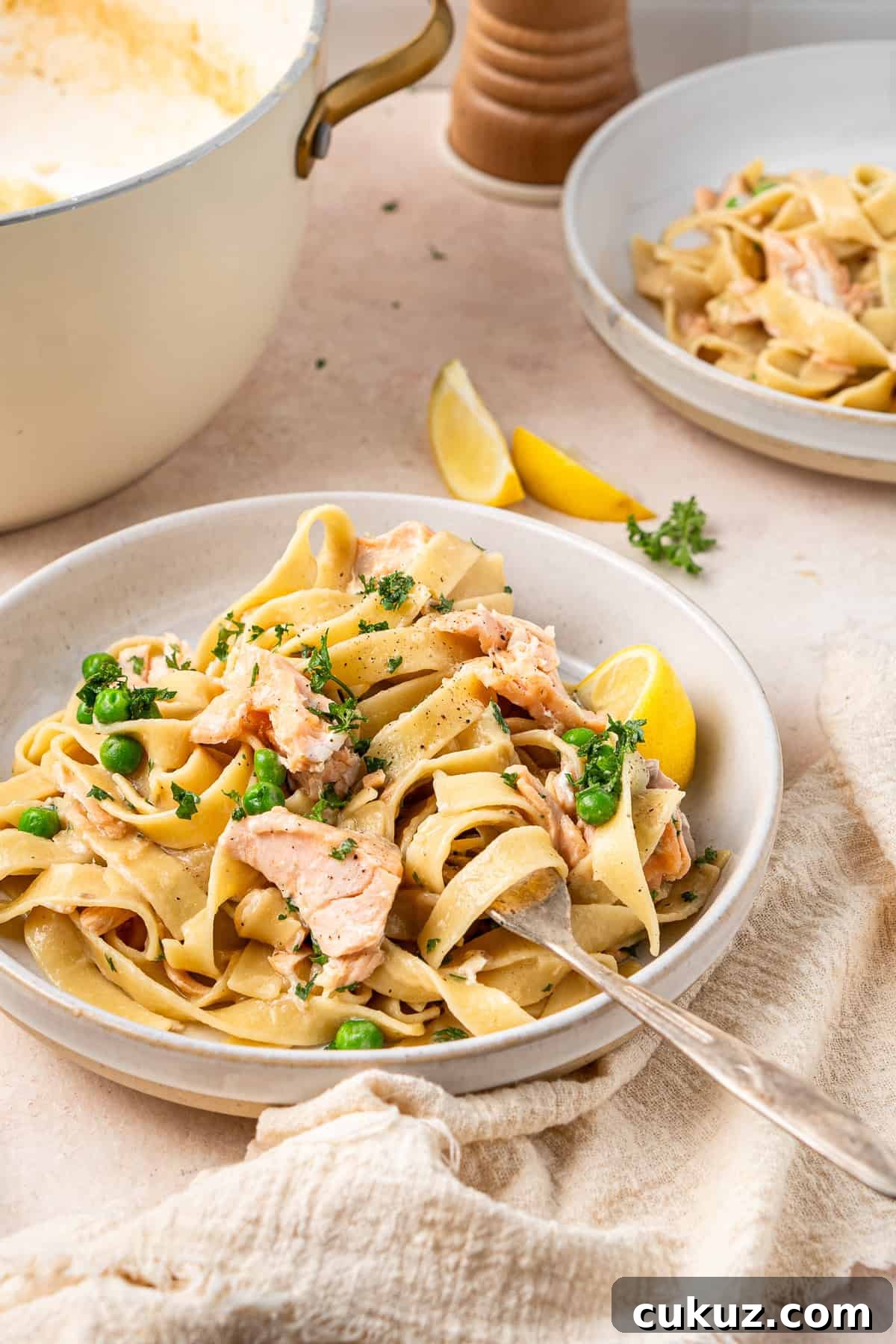 Creamy Dairy-Free Salmon Tagliatelle Recipe 11 A plate of creamy salmon pasta without cream with a fork.