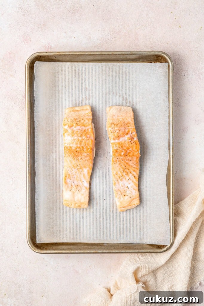Creamy Dairy-Free Salmon Tagliatelle Recipe 7 Oven baked salmon on a baking tray.