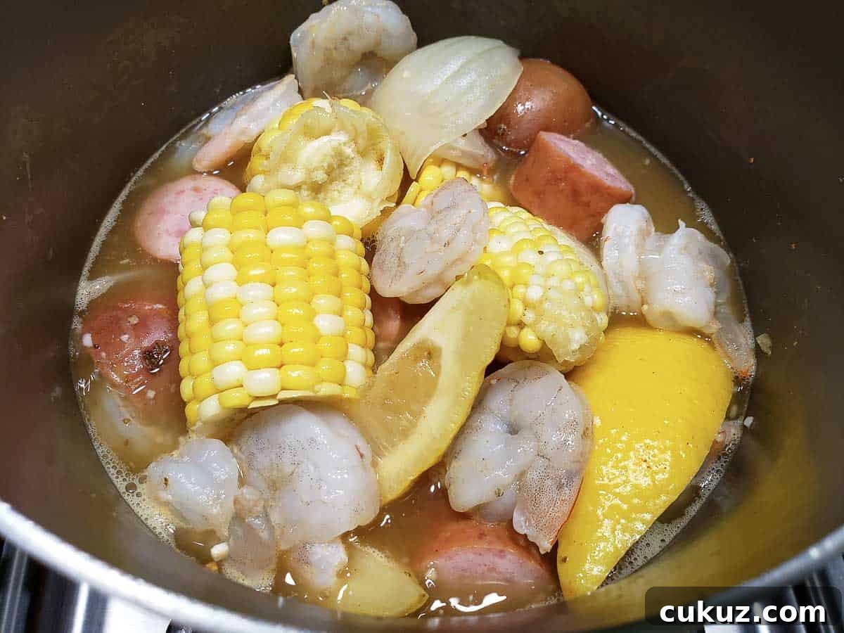 Shrimp Boil for Two cooking in a pan.