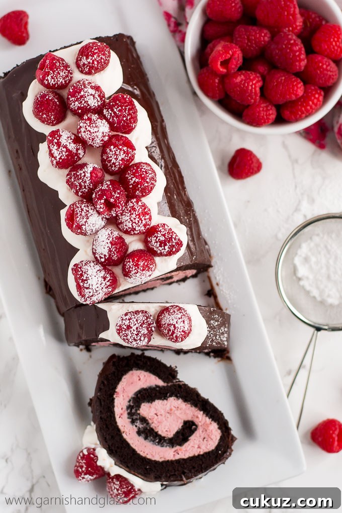 With raspberry cream filling, chocolate ganache, whipped cream, and fresh berries, this Raspberry Chocolate Swiss Roll is sure to make your Valentine swoon.