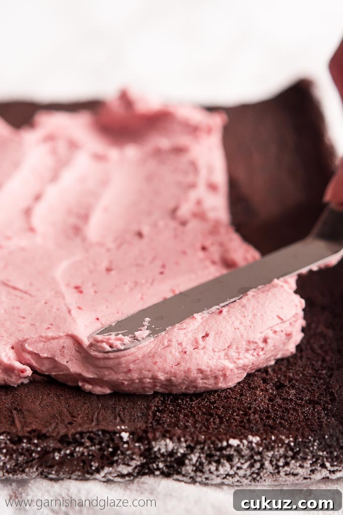 With raspberry cream filling, chocolate ganache, whipped cream, and fresh berries, this Raspberry Chocolate Swiss Roll is sure to make your Valentine swoon.