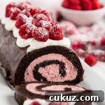 With raspberry cream filling, chocolate ganache, whipped cream, and fresh berries, this Raspberry Chocolate Swiss Roll is sure to make your Valentine swoon.