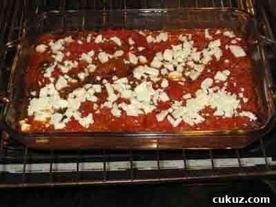 Add feta to the cooked piperies.