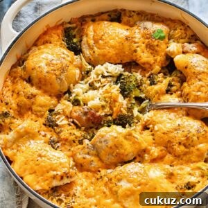 Cheesy Chicken and Broccoli Rice Casserole Recipe 5 Top down shot of cheesy chicken and broccoli casserole in a large pan with rice