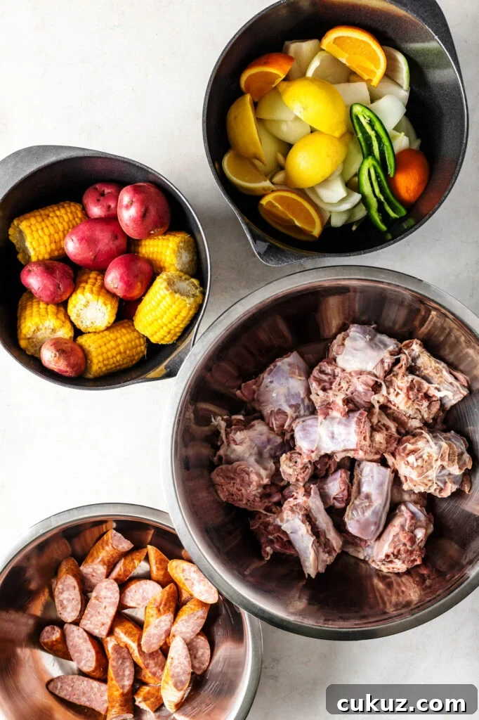 Cajun Turkey Neck Boil with Smoked Sausage, Potatoes & Corn 3 cajun turkey neck boil ingredients. lemons, onions, jalapenos, oragnes, red potatoes, corn nibblers, turkey necks, and smoked sausage
