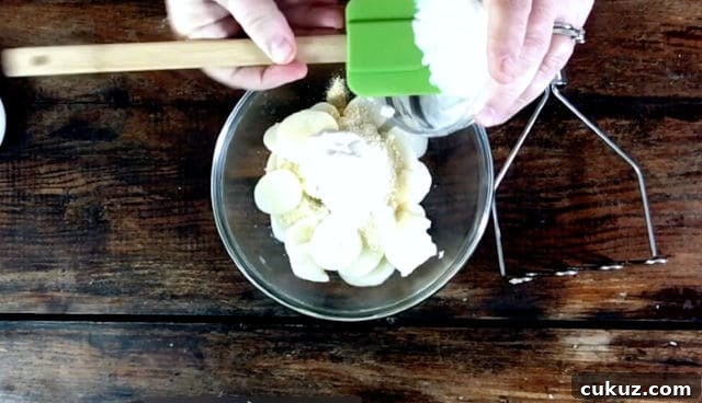 Canned Mashed Potatoes: Quick Tips for Perfect Results 5 Adding the sour cream and parmesan cheese to the potatoes in the bowl