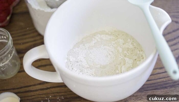How to Make Delicious Bread with Sourdough Discard 8 flour, water, yeast, sourdough discard, and salt in a white stand mixer bowl