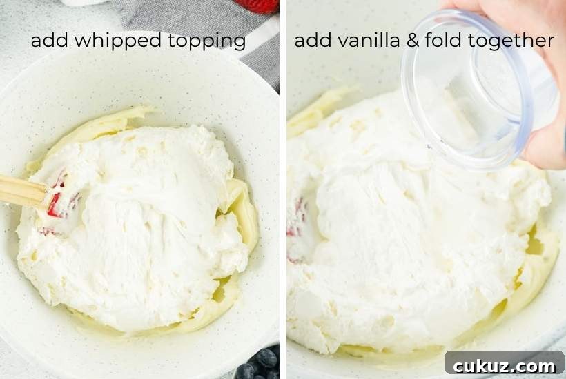 Summer Berry Cheesecake Salad Recipe with Creamy Whipped Topping 5 folding in the whipped topping and vanilla to the cream cheese mixture