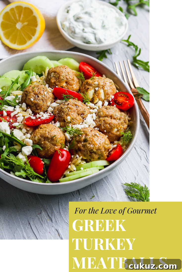 Greek turkey meatballs are the perfect way to use the ground turkey in your freezer. Served with lemon orzo pasta, arugula, tomatoes, cucumbers, and homemade tzatziki sauce, these Greek meatballs are the perfect easy dinner and bursting with flavor! #dinner #meatballs