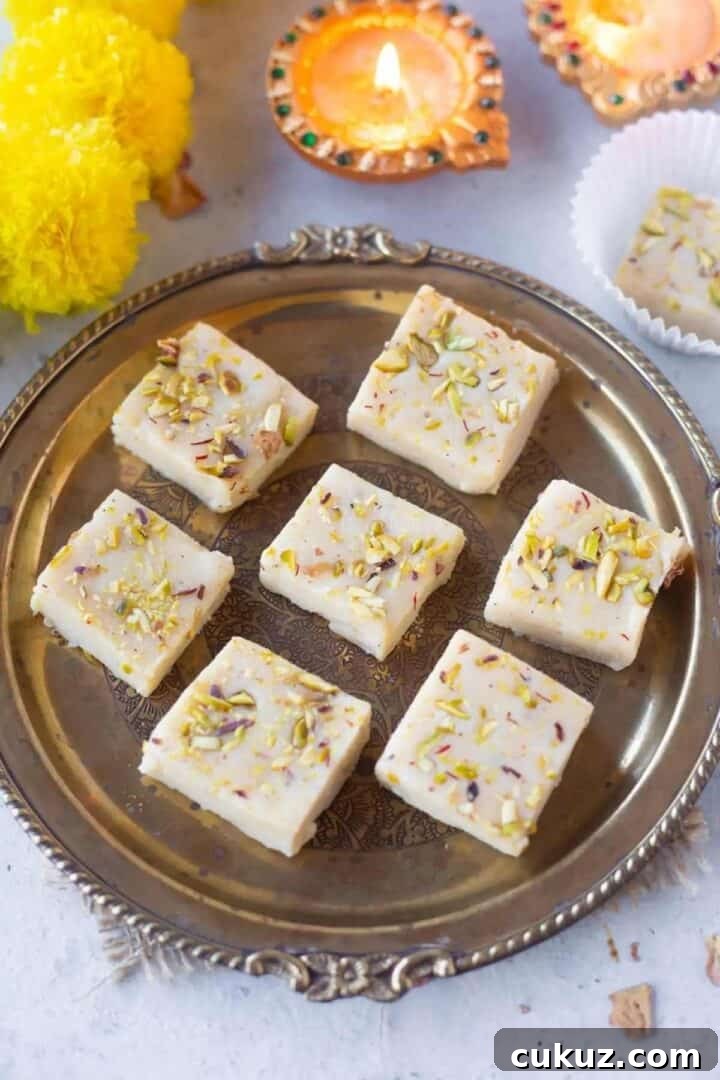 Kalakand squares placed on brass plates