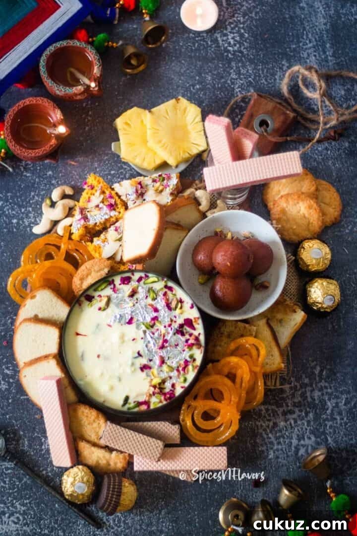 different sweets that you can serve along with Instant Rabdi placed on a wooden platter