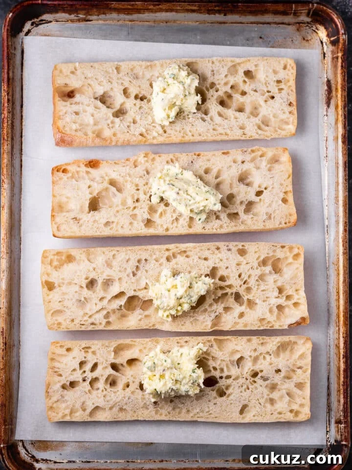 dollops of garlic butter on ciabatta baguette pieces