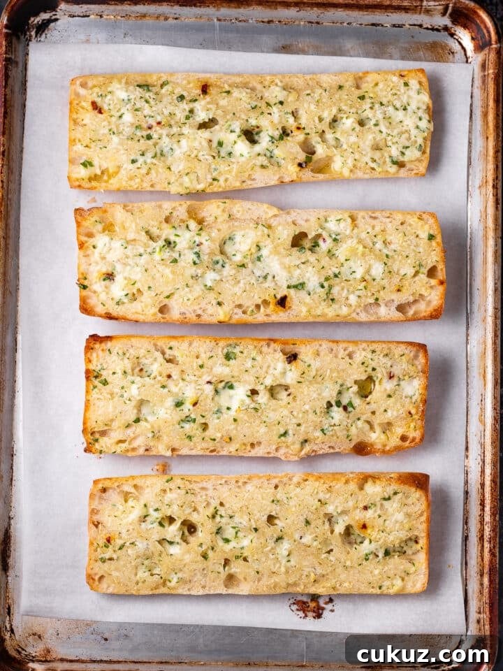 baked ciabatta garlic bread on a sheet pan