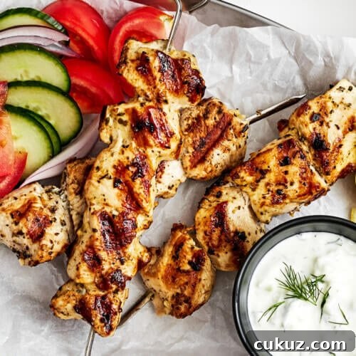 Chicken souvlaki with veggies on a plate
