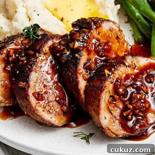 Slices of honey garlic pork tenderloin.