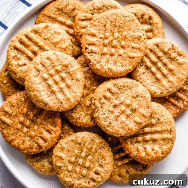 Close up of almond flour peanut butter cookies on a white plate.