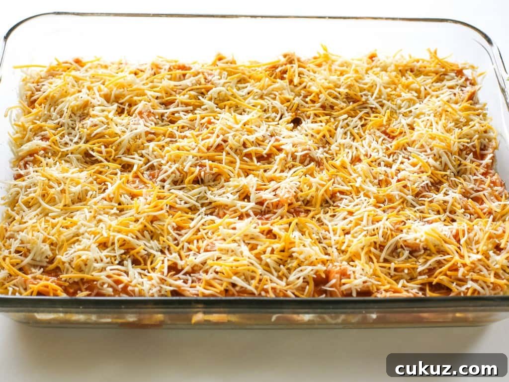 Chicken Tamale Casserole Recipe: Cheesy Mexican-Style Bake 6 Topped with cheese