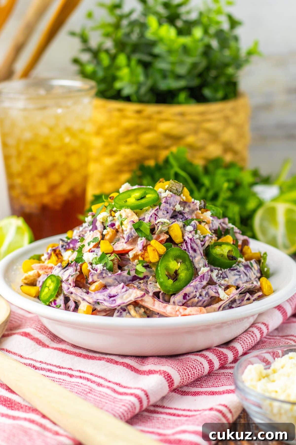 Large white bowl of mexican street corn coleslaw.