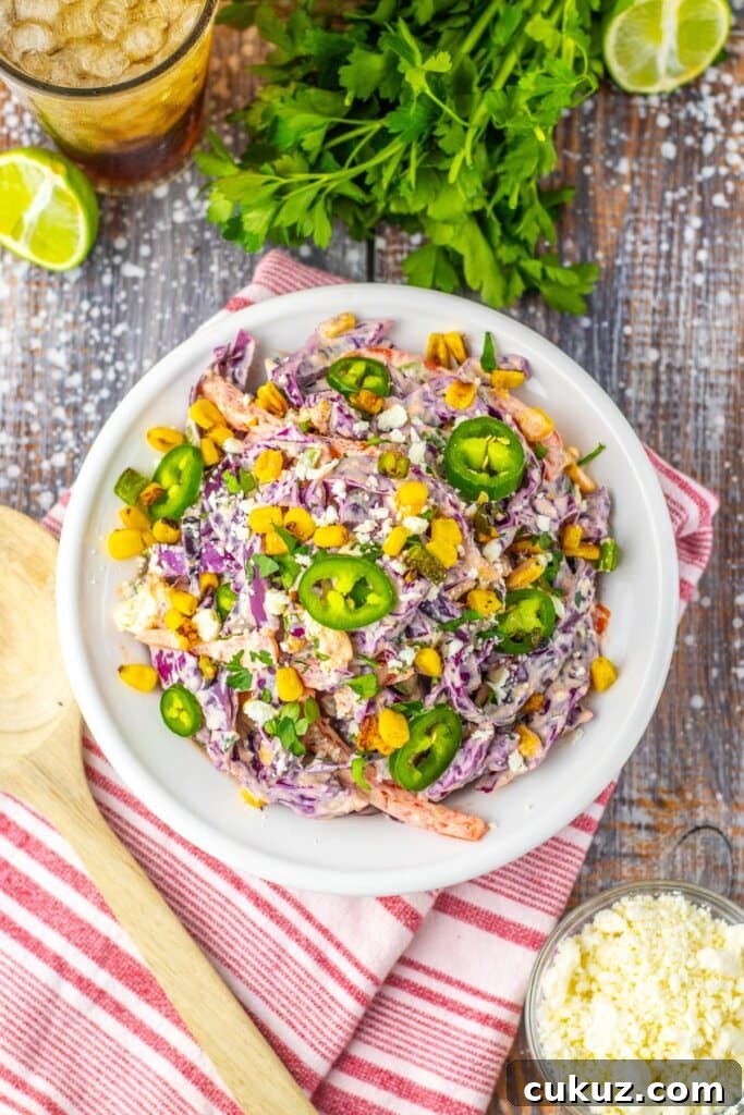 Large white bowl of mexican street corn coleslaw.