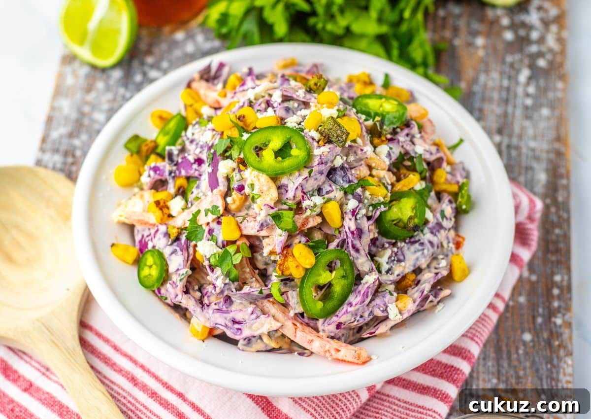 Large white bowl of mexican street corn coleslaw.