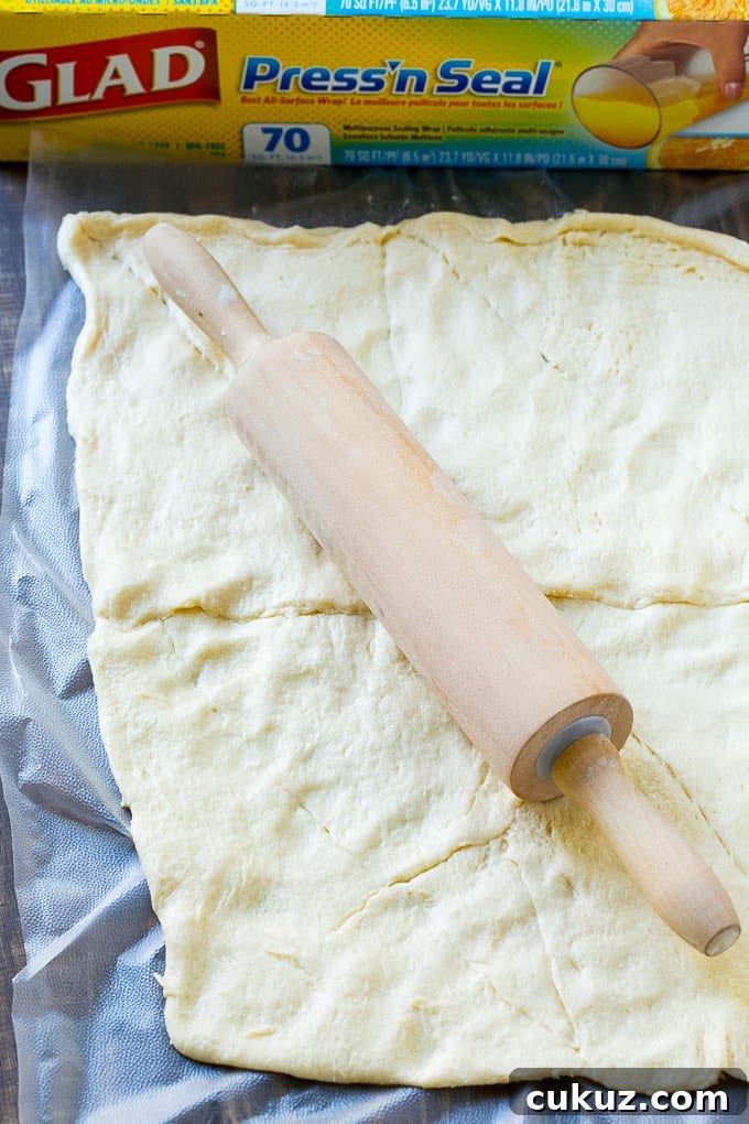 Crescent roll dough rolled out into a rectangle.