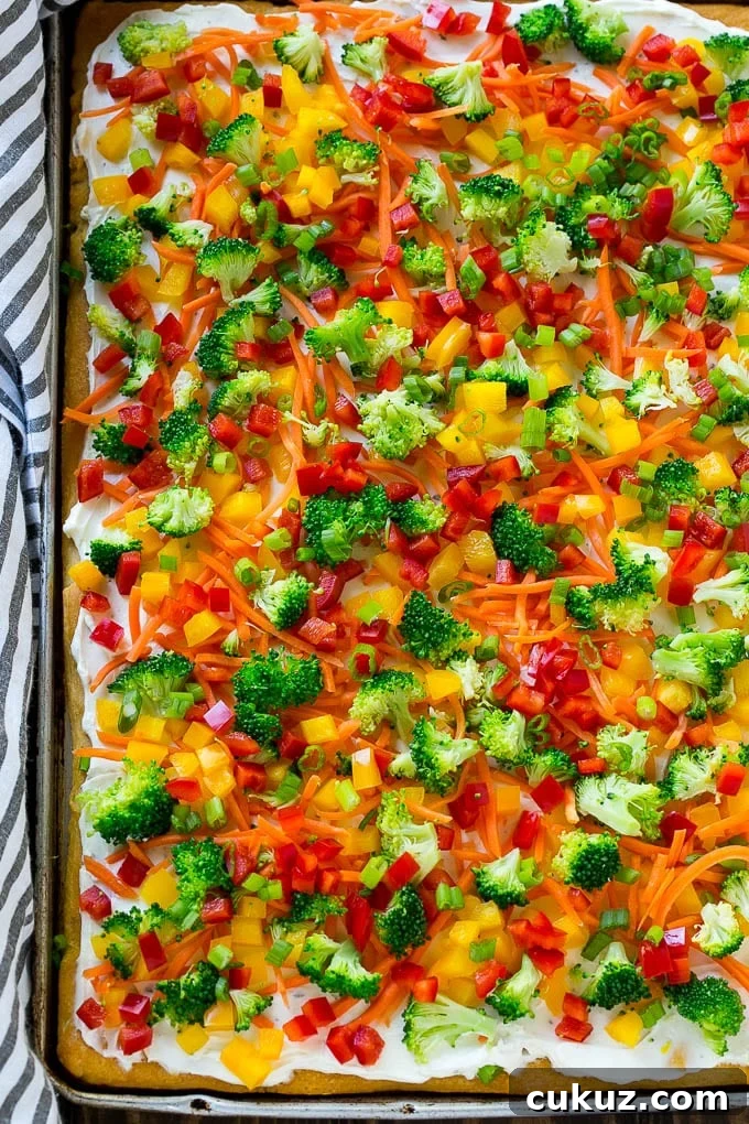 A sheet pan of crescent veggie pizza.