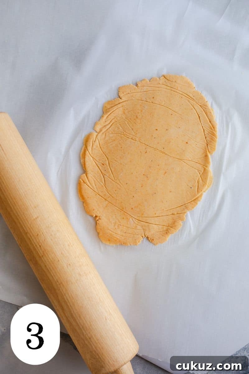 Rolled dough on parchment paper.