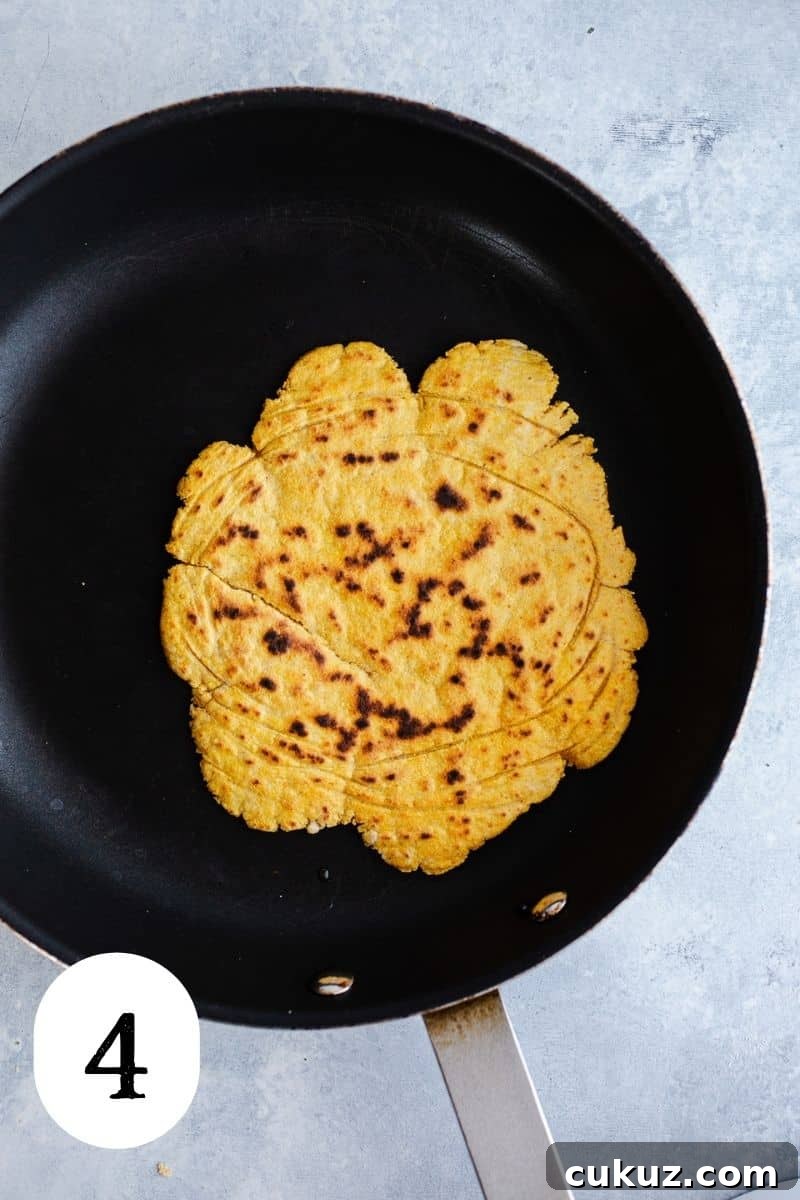 Cooked flatbread in a nonstick skillet.