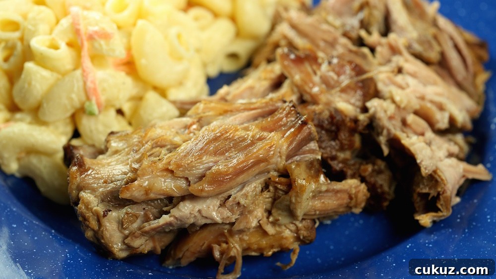 Crock Pot Kalua Pork and Hawaiian mac salad on a blue plate